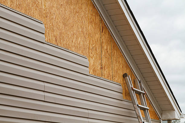 Professional Storm Damage Siding Repair technician working in Merion Station, PA